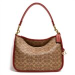 Borsa a tracolla COACH Cary Signature tela rivestita Tan
